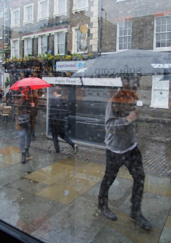 c.04.Mary.umbrellas in the rain.